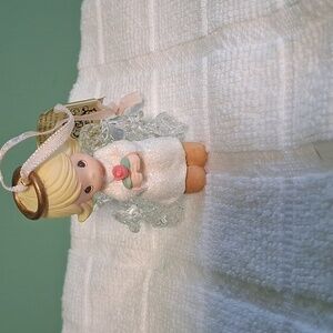 1/ Precious Moments Angel Holding Flowers
